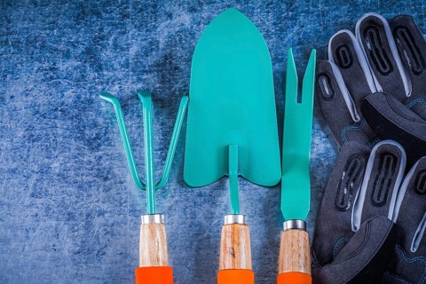 Metal rake trowel weeding scoop safety gardening gloves agriculture concept