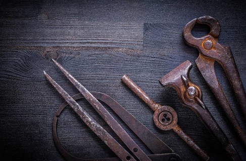 Set of vintage tools on wood board