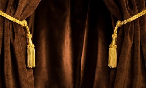 Brown theatre curtain and yellow tassels