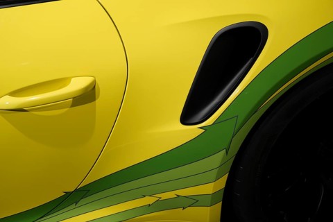 Close-up detail of the yellow-green paintwork and ventilation of a car, exhibition, Neues
