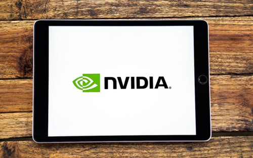 Nvidia logo on smartphone screen with AI in the background. Nvidia Corporation is an American