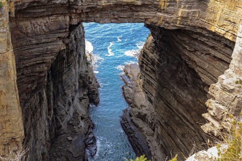 Tasman Arch has been created by the wind and waves for millions of years, Eaglehawk Neck, Tasmania,