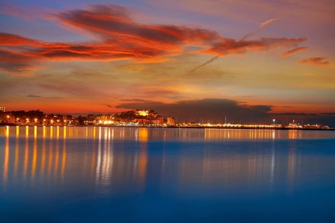 Denia sunset skyline from Las Rotas in Alicante of Mediterranean Spain