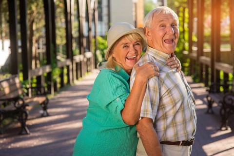 Senior woman hugging man. Elderly couple is laughing. Trust and support. Live entire life together