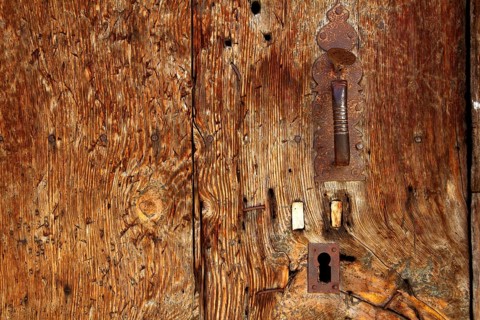 Aged wood door grunge texture rusty handle vintage wooden detail