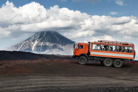 KAMCHATKA, RUSSIA, JUNE 24, 2016: Russian expedition truck KamAZ (6-wheel drive) on mountain road