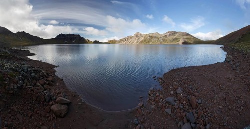 Panorama mountain landscape of Kamchatka Peninsula: beautiful summer view of crater lake of Khangar