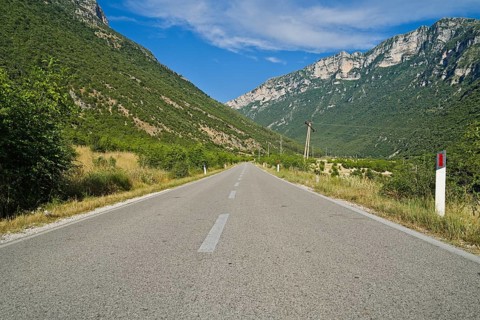 Vjosa river valley main road to the city of Permet during summer without any cars driving