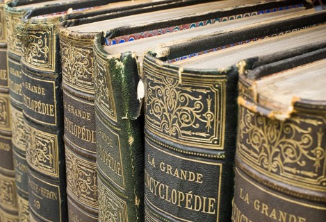 Old books on shelf. French encyclopedia. Close up shot