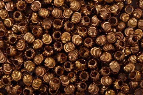 Golden beads close-up on a background