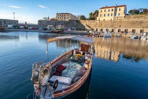 Small traditional fishing boat in Port Tino Rossi, the fishing and pleasure boat harbour near the