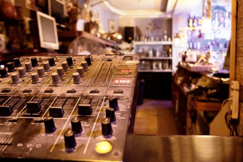 Music control center or deck in a retail store with sound, amplifier and mixing knobs for