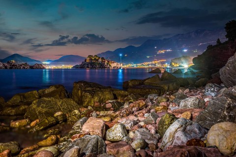 Night over stony sea shore in Sveti Stefan, Montenegro, Europe