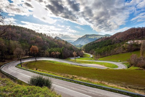 December. Central Italy. Winding mountain road serpentine after the rain. Wet asphalt. The