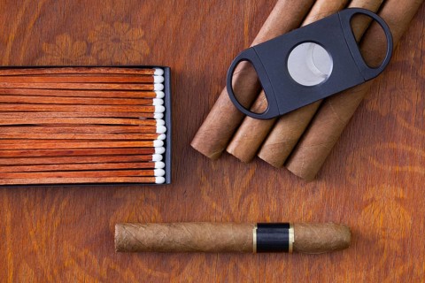 Different cigars on the decorative wooden table