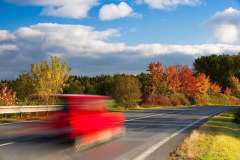 Speed car on a road in Krkonose mountain, Czech Republic, Europe