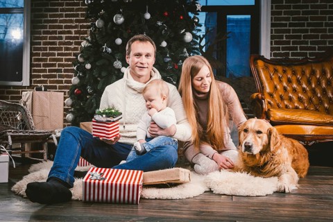 Theme Christmas and New Year family circle and domestic pet. Mom dad and child 1 year old Caucasian