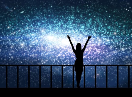 Silhouette of young happy woman stands on the bridge in cosmos