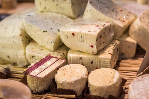 Pieces of delicious white goat cheese with spices