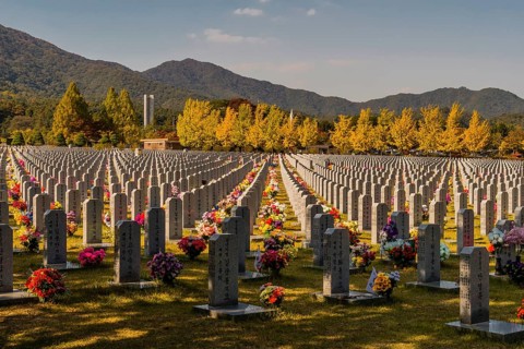 Daejeon, South Korea, October 27, 2019: War memorial and hercules missile above trees in fall