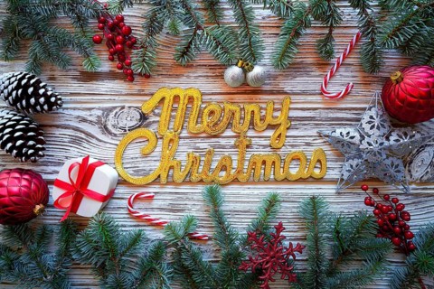 Merry Christmas spell word on white wood background