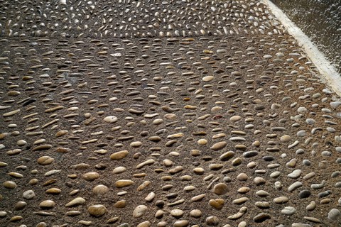 Altea soil rolling stone mosaic on flooring of Alicante Spain