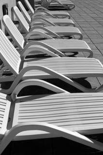 White resin solarium hammocks row black and white