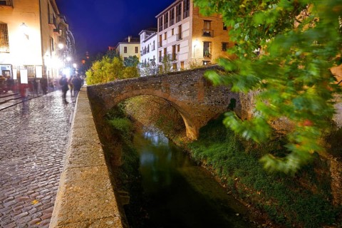Darro carrera street river and arch in Granada of Spain at Andalusia