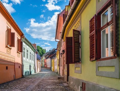Beautiful Transylvanian street on a sunny summer day in Sighisoara, Romania, Europe