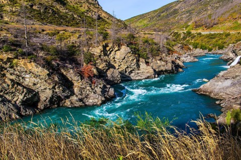 New Zealand. Magnificent mountainous rapid river with melted glacial water and steep banks. Scenic