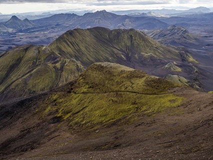 View from Mount Sveinstindur, volcanic landscape, moss-covered hills, mountains, Icelandic