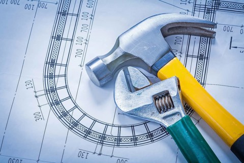 Claw hammer adjustable key on blueprint building and architecture concept