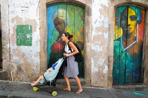 Tourist walking in the colorful historic district of Pelourinho, Bahia, Brazil. Historic