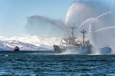 KAMCHATKA, RUSSIA, APR 27, 2019: Firefighting and rescue ship of Pacific Fleet of Russia spraying