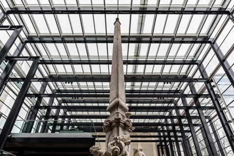 Ljubljana, Slovenia, 04 07 2018: Fountain, column and glass and steel construction at the National