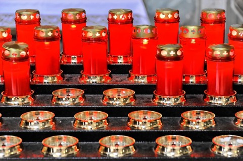 Red prayer candles lit for sacred devotion, Assisi, Umbria, Italy, Europe