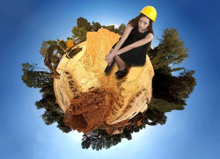A Female Construction Worker on a job site wearing a hard hat