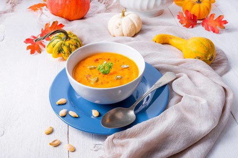 Healthy pumpkin soup with ginger carrots and coconut milk