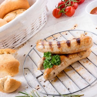 Delicious bratwurst with ketchup and fresh rolls