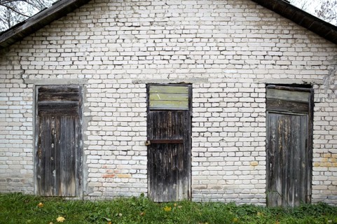 Three doors in the old grey brick garage