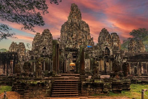 The famous Bayon temple with the ancient stone faces