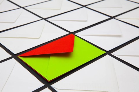 Composition with white and colored envelopes on the table. The photo suitable for various holidays