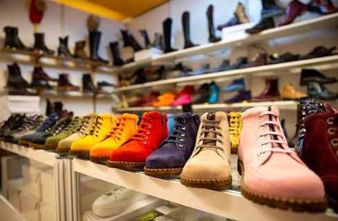 Colorful women boots/shoes are seen arranged