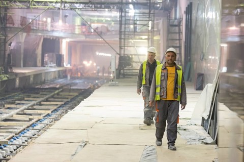 Sofia, Bulgaria - April 19, 2016: Two underground subway tunnel workers are going for lunch during