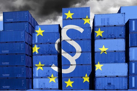 PHOTOMONTAGE, Stacked containers with EU flag and paragraph sign, symbolic photo supply chain law