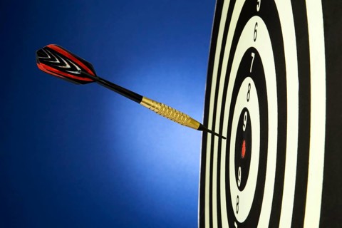 A dart game with a dart that hit the bull's eye. Austria