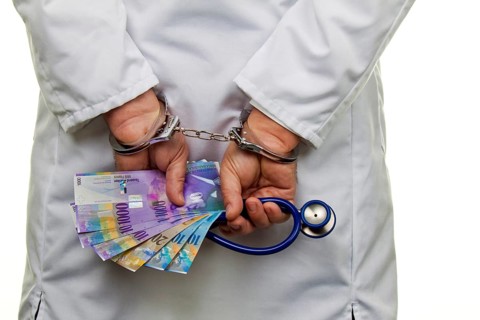A doctor with Swiss franc banknotes and handcuffs Austria