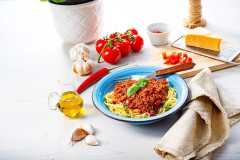 Delicious spaghetti bolognese on a white background