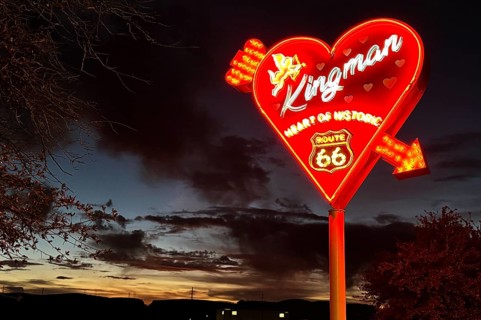 Kingman neon sign in front of a dramatic evening sky, Kingman, Arizona, USA, North America