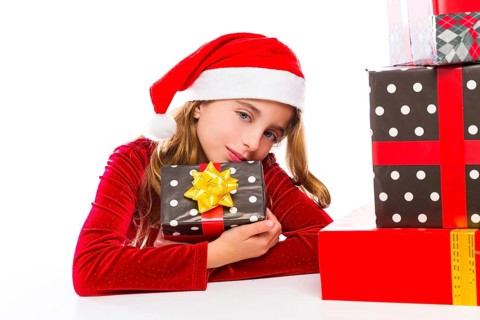 Christmas Santa kid girl happy excited with ribbon gifts isolated on white background